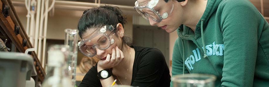 UMass Boston students working in a lab.