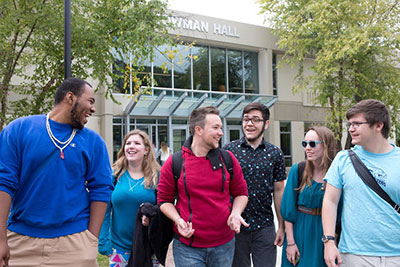 Students walk and laugh on the MCLA campus