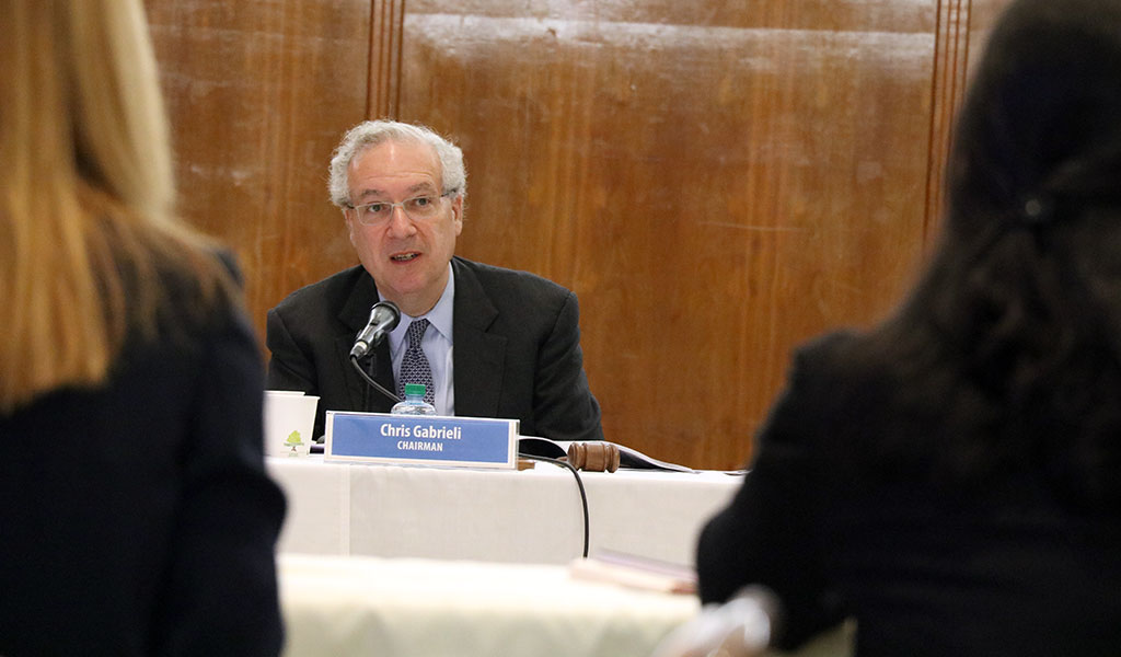 Chris Gabrieli speaks at a board meeting