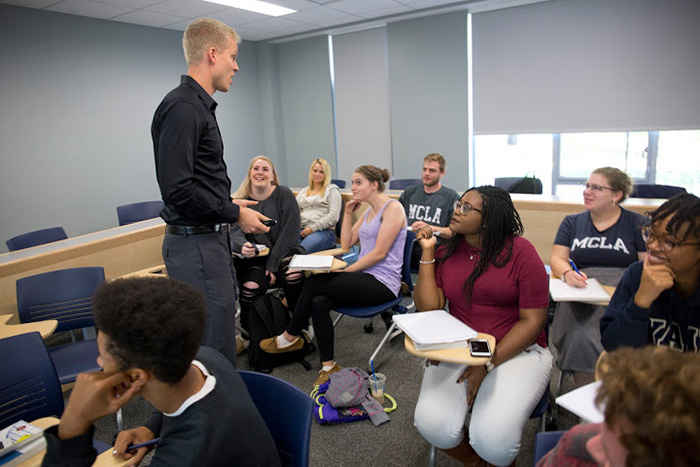 MCLA professor lectures to a small classroom