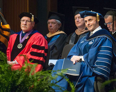 Commissioner Santiago sits with President of Westfield State University, Ramon S. Torrecilha at his Investiture Ceremony.