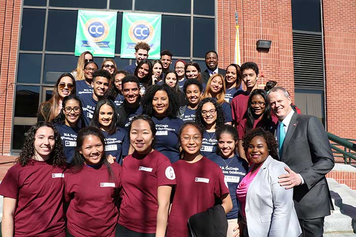 Governor Baker poses with GEAR UP Students at the Commonwealth Commitment announcement at Middlesex Community College