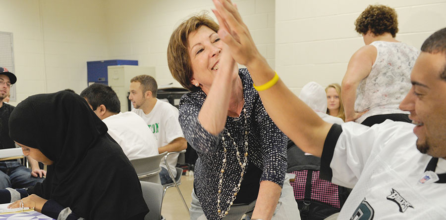 professor gives student a high-five