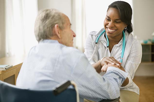 Nurse helping an elderly man