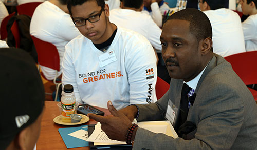 A 100 Males participant in Framingham listens to a mentor at Framingham’s launch event in February 2016