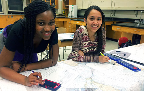 John D. O'Bryant students studying coastal navigation.